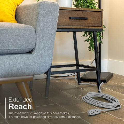 Three Outlet Extension Cord With 25 Foot Grounded Power Cord For Home Office And Media Setups coiled on floor near sofa and table