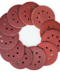 110 Pack 5 Inch 8 Hole Sanding Discs Set With Hook And Loop Aluminum Oxide Pads, arranged in a circle, for sanding projects