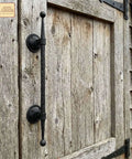 Mystic Colonial Cast Iron Door Handle Handforged Antique Pull installed on rustic wooden gate