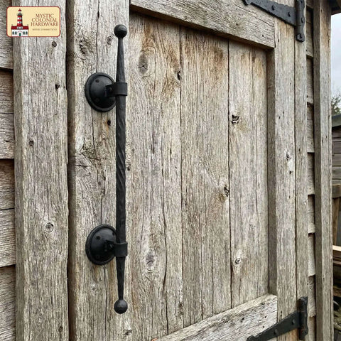 Mystic Colonial Cast Iron Door Handle Handforged Antique Pull installed on rustic wooden gate