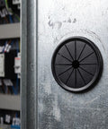 Check These 10 Pack Black Cable Grommets For Your Desk. Petalshaped Design Makes Wiring A Breeze With Secure Grip Locking Tabs To Save The Day And Keep Cords Safe From Damage While Styling Out Your Setup. black nylon cable grommet on metal desk panel, front view