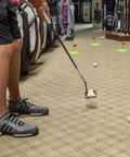 Man practicing indoors with Pure Putt Challenge Three Pack Putting Cups For Indoor And Outdoor Practice Anywhere, USGA-size holes