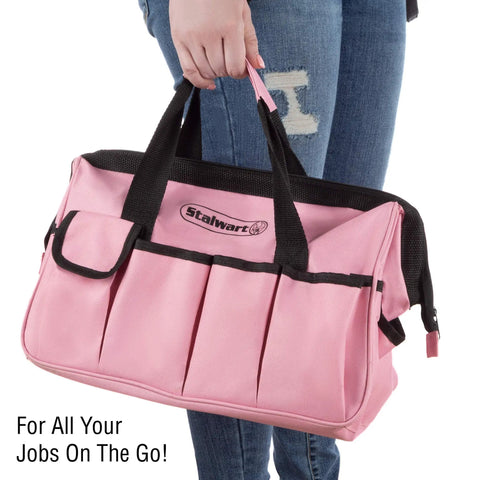 Person holding a pink carrying bag from the Pink 123 Piece Tool Kit With Carrying Bag Heat Treated Steel Hand Tools And Repair Set For Apartments Dorms And Homeowners All Your Must Have DIY Essentials For Quick Fixes And Everyday Projects