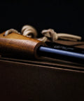 Close-up of Go-To 5.9 Inch Ferro Rod Fire Starter Kit with Wooden Handle and Sheath Waterproof Flint Steel Ignition for camping.