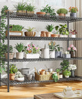 Heavy Duty Garage Shelving Unit with 4 Tier Adjustable Wire Shelves 2560 Lbs Capacity 55.5 Inch Wide Industrial Storage Rack for Home Shop and Commercial Use with potted plants