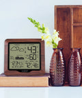 Backlit Wireless Forecast Weather Station With Pressure And Temp Trends Indoor Outdoor Temp Humidity 24 Hour Pressure History Temperature Alerts And Continuous Display on a wooden shelf with decor