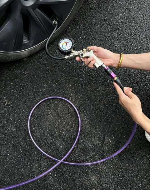 Using Badass Heavy Duty 100 Ft 1/4 Inch Reinforced Polyurethane Air Hose to inflate a tire with gauge.