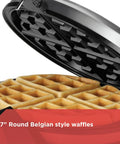Open view of Four Slice Belgian Waffle Maker With Flip Feature For Evenly Cooked Waffles showing a perfectly cooked waffle