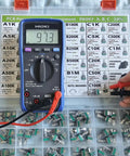 Vertical PCB Mount Potentiometer Kit, 100 Pieces, 9mm Pot, 15mm Shaft, 10 Percent Tolerance used with a multimeter.
