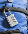 Set Your Own Small Aluminum Lock For Travel Backpacks Cabinets And Zippers With A Three Digit Code on a blue backpack zipper