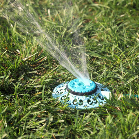 Sprout Metal 8 Pattern Sprinkler With Quick Connect Adapter Amazon Bundle In Gooseberry Green on grass, water spraying.