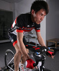 Cyclist using Indoor Bike Trainer Sweat Net Guard Dual Layer Absorbing Catcher That Keeps Your Frame And Floor Dry Stops Sweat