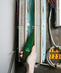 Hand using Wire Tracer Kit With Tone Generator For Cable Locator, Non Contact Probe, on cable panel