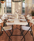 Dining setup on Six Foot Fold In Half Blow Molded Folding Table For Indoor And Outdoor Use With Comfort Handle Lightweight Plastic Top