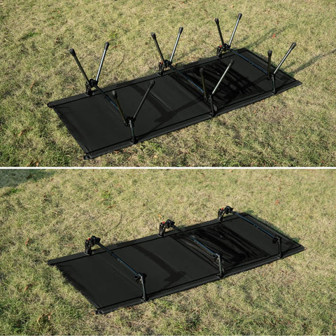 Super Sturdy Height Adjustable Camping Cot With Leg Extenders Holds Up To 330 Pounds folded on grass.