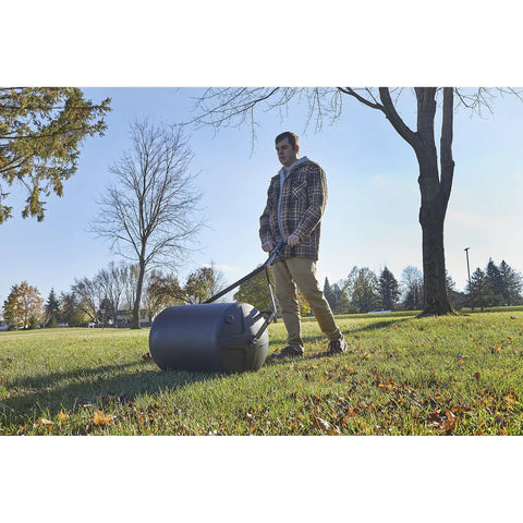 Man using Lawn Roller 18 Inch Diameter 24 Inch Wide Poly Drum Holds Up To 270 Lbs And 31.1 Inch Working Width For Versatile Push And Tow