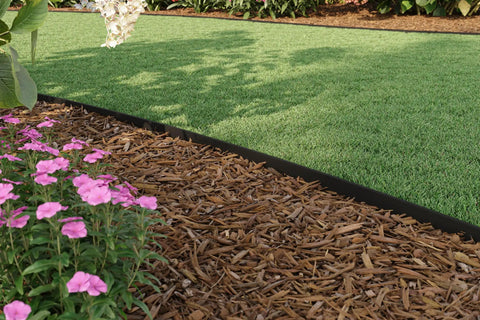 4 Inch Composite Landscape Edging Kit With 40 Foot Roll And 24 Anchoring Stakes Contractor Grade Black Edging in garden