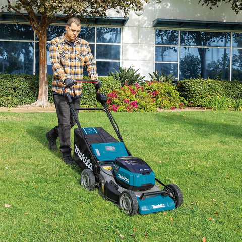 User operating the Top Shelf 21 Inch Cordless Lawn Mower Built Ridiculously Tough With A Badass Brushless Motor And Quad Battery Slots To Handle Big Yards Without Gas Grief Tool Only on a grassy area.