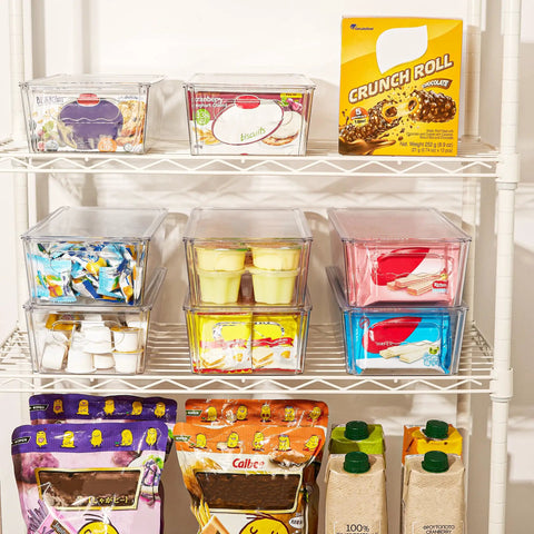Top Shelf Eight Piece Clear Stackable Storage Bins With Slick Snap Lids, organized pantry shelf display of snacks.