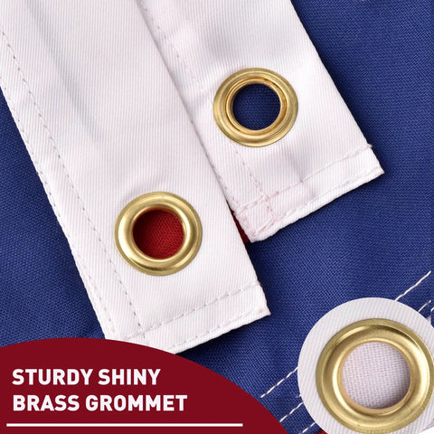 Close-up of brass grommets on Outdoor 3x5 Ft American Flag Deluxe Heavy Duty Spun Polyester Tearproof And Waterproof All Weather High Wind Flag with Embroidered Stars Sewn Stripes Brass Grommets Built To Stand Up To Any Weather, Tough As Nails