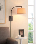 Oil Rubbed Bronze Sweep Wall Lamp With Adjustable Swing Arm And Swivel Shade, Sleek Modern Minimalist Vibe, in living room