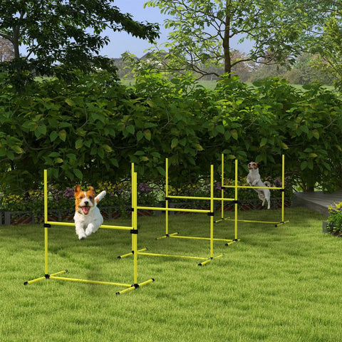 Dogs jumping over Four Piece Adjustable Dog Agility Jump Set Training Kit with Portable Carry Bag For All Sizes in park setting