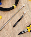Stainless Steel Alligator Clips Set With Telescopic Wire Clamps And Pen Clip on wooden table next to pliers and cable