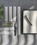 Metal Architect Ruler 12 Inch Pro Grade With Four Bevel Scales For Drawing Drafting And Engineering Left To Right Calibrations One Thirty Second One Sixteenth One Eighth And One Quarter For Precise Measurements. Metal drafting rulers, notepad, and pen on desk