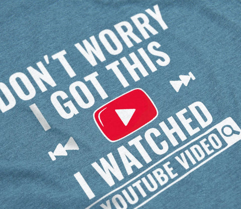 Funny DIY Mechanic T Shirt For Men I Watched A YouTube Video Design Indigo Blue fabric with white and red print detail.