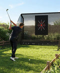 Golfer using Backyard Golf Practice Net 10x7ft With Auto Ball Return And Side Barriers Pro Grade Easy Setup Outdoor Practice