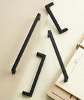 10 Pack Solid Aluminum Matte Black Cabinet Pulls with 5 Inch Hole Center Square Style Handles shown on a light surface