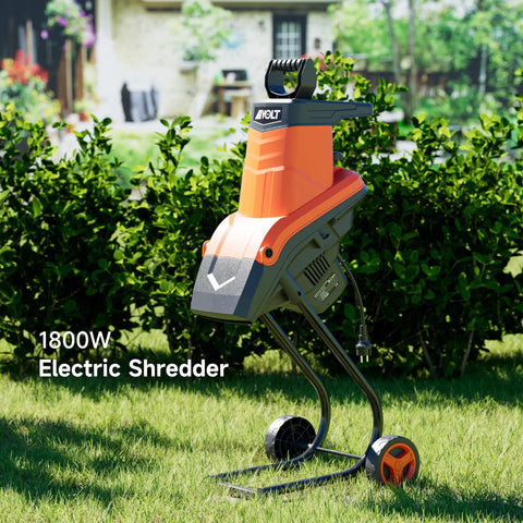 Electric Wood Chipper Shredder 1800W Portable Mulcher with handy collection bag in garden setting
