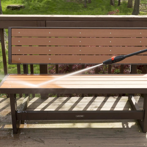 Beastly 2000 Max PSI Electric Powered Pressure Washer With 14.5 Amp Motor cleaning a deck bench with adjustable nozzle