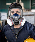 Worker wearing 80mm full face mask with replaceable filter cartridges set, dual filters pack with 4 carbon and cotton for professional filtration
