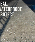 Close-up of treated concrete with water droplets, demonstrating Concrete Sealer One Gallon Covers Up To Four Hundred Square Feet Deep Penetrating Silane Siloxane Formula For Driveways And Patios Rock Solid Waterproof Shield Built Tough To Handle Rain Snow And Summer Heat Daily.