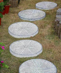 Installed stepping stones using Two Pack Round Concrete Walk Maker Molds Ultra Durable Plastic Stepping Stone Molds for outdoor walkways.