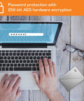 Person using laptop with 2TB My Passport Ultra Portable External Hard Drive With Ransomware Defense and Password Protection