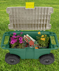 Open view of a green plastic garden bench on wheels revealing built-in storage with gardening tools and plants inside. Rolling Garden Cart With Seat And Interior Tool Tray Green Plastic Garden Bench On Wheels For Easier Weeding Planting And Light Transport Includes Built In Storage For Tools And Supplies No More Crawling Or Kneeling.