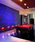 Sky Lite LED Laser Star Projector with green stars and blue nebula clouds illuminating a billiard room for instant atmosphere.
