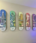 Hella Dope Skateboard Deck Hangers Transparent Floating Display Mount With Adhesive Strips showcasing colorful city-themed decks