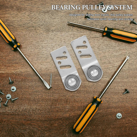 4 Pack Badass Stainless Steel Sliding Door Pulley Wheels with 23mm Axle Bore Hella Smooth Ball Bearing Rollers on a workbench.