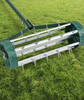 Rolling Lawn Aerator 18 Inch Rotary Push Tine Spike Soil Aerator With 3 Piece Long Steel Handle on grass surface