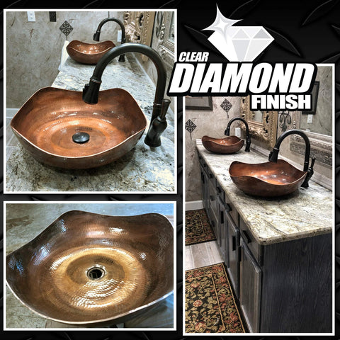 KBS DiamondFinish copper vessel bathroom sink with black faucet installed on granite vanity countertop.