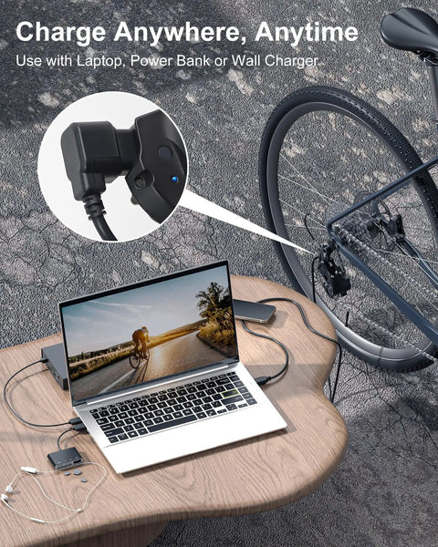 Di2 Charger Replacement Cable EW-EC300 1.5m USB Type-A connected to bike and laptop on outdoor table