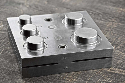 Front view of Pro Grade 2 Inch Disc Cutter Kit with six punches designed for jewelry and metalworking in aluminum, brass, and more.