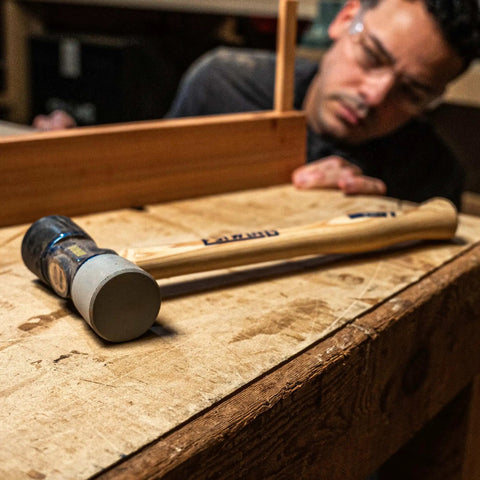 12 Oz Double Face Rubber Mallet With Soft And Hard Tips And Hickory Handle Built With Triple Wedge Construction on workbench