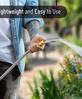 Person watering garden with Heavy Duty Stainless Steel Garden Hose 3 Feet Short All Metal Water Hose No Kink Built To Last