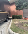 Package delivery truck near a brick building, showcasing delivery scene for Wireless Door Alarm Kit With 4000 Ft Range 120 dB Siren.