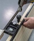 Close-up of All-In-One Adjustable Door Hinge Jig Installation Kit For 2 Ft 6 In To 9 Ft Doors being used on a wooden door.