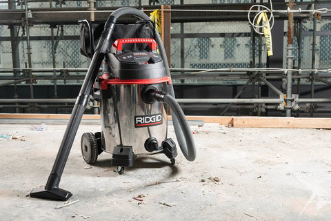 16-Gallon Stainless Steel Wet Dry Shop Vacuum With Cart, Pro Hose, Drain And Blower Port, 6.5 Peak HP Motor on concrete floor